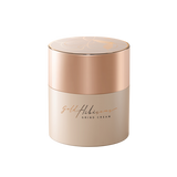 Skincare jar with gold lid and beige body on a white background