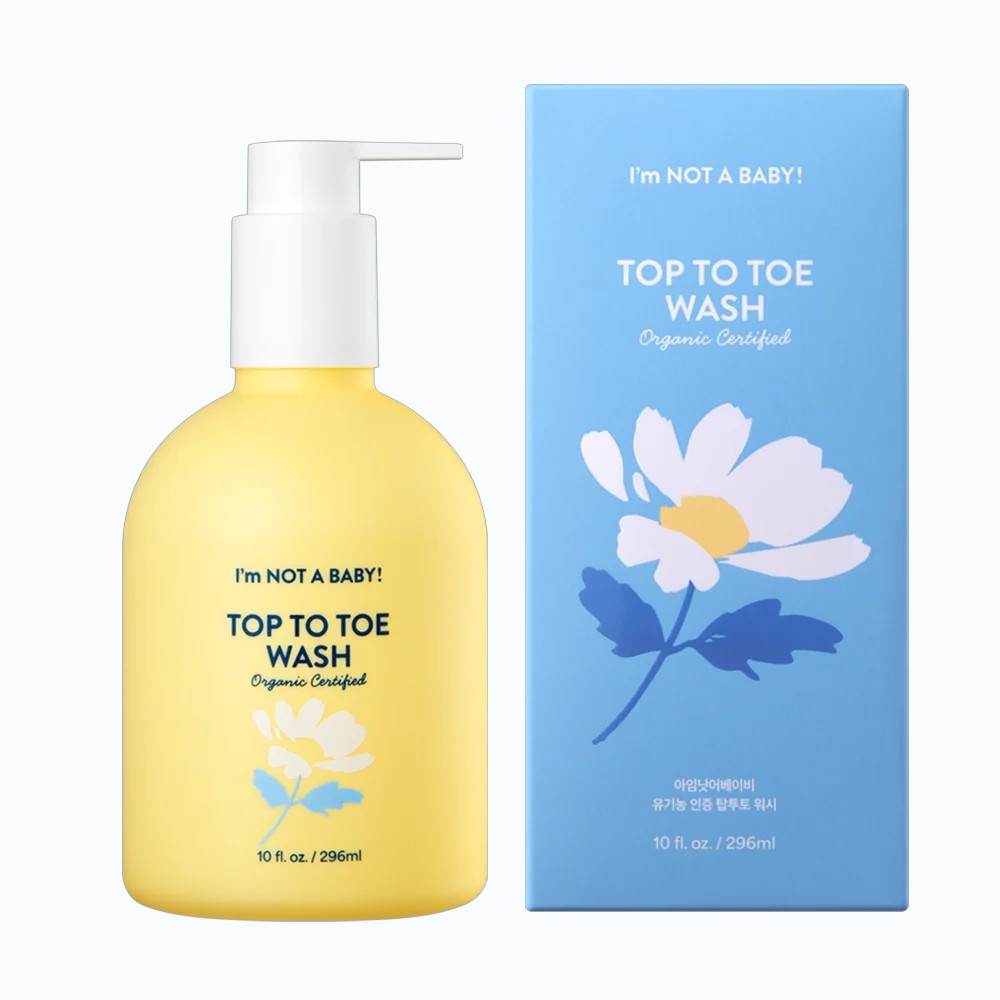 Yellow bottle of 'I'm Not a Baby' top to toe wash with a blue box featuring a daisy design on a white background.