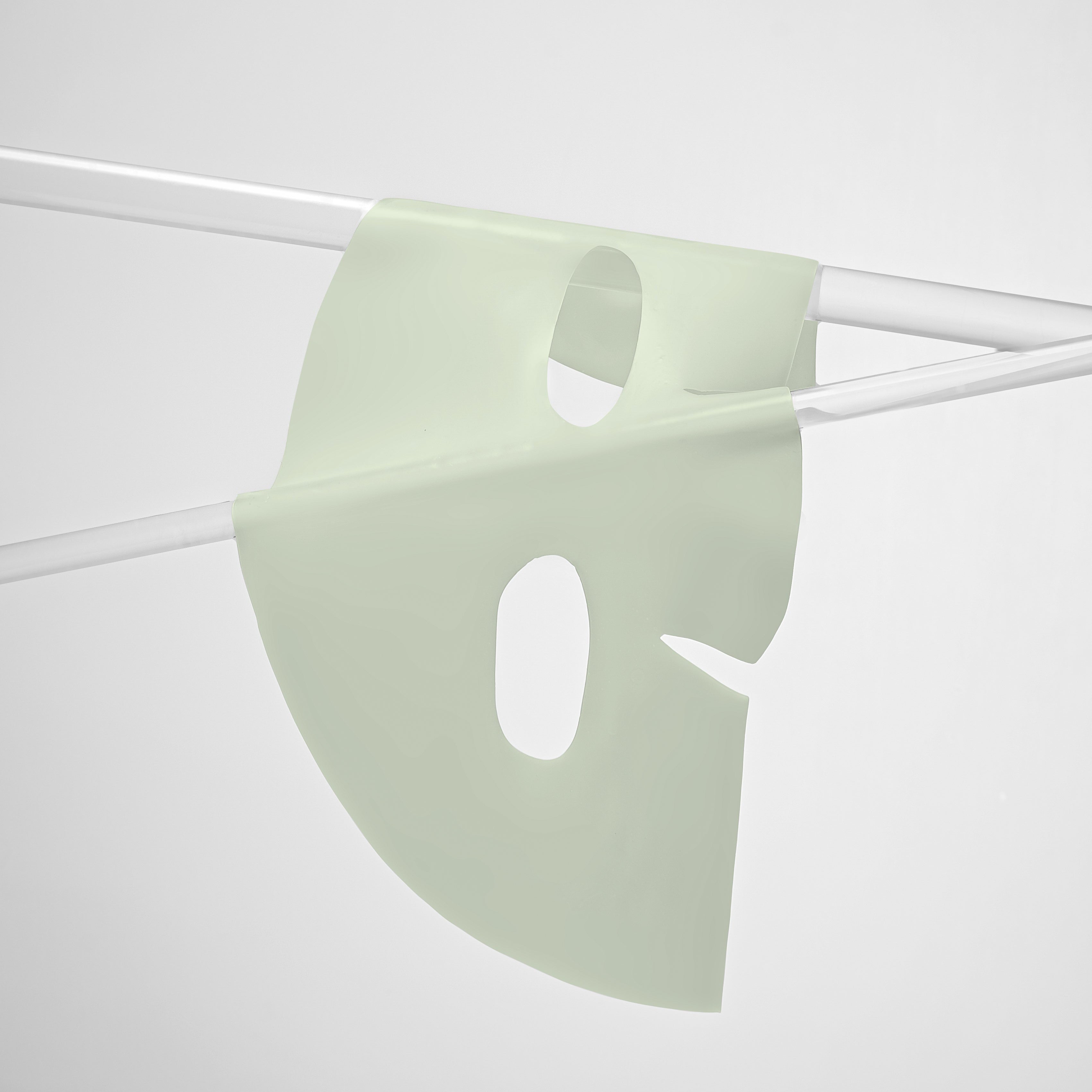 Light green face mask on a white background