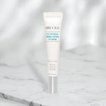 Brucke A.C.C. Intensive Wrinkle Repair Eye Cream tube on a marble surface with a white background