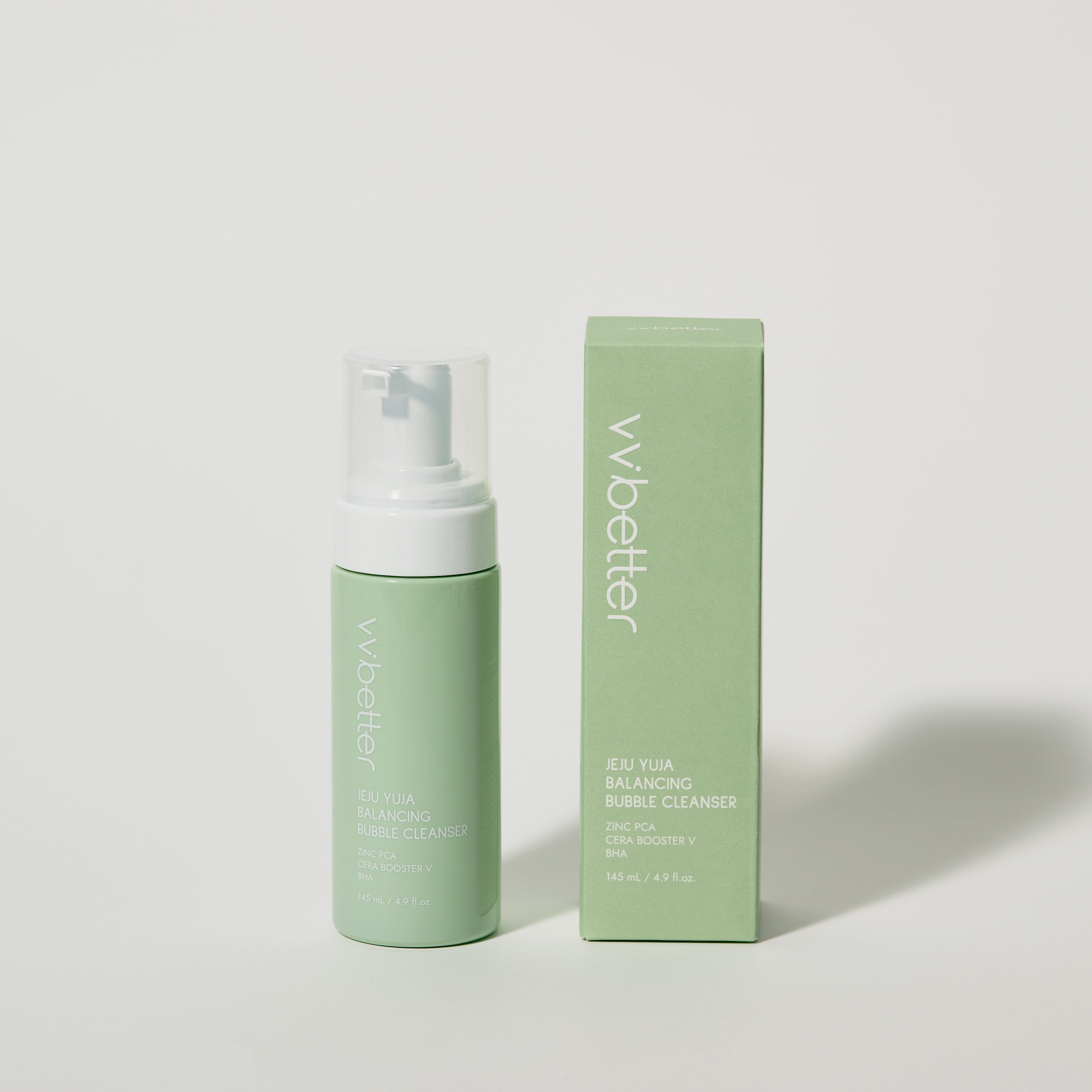 Green bottle and box of 'wbetter' product on a light gray background