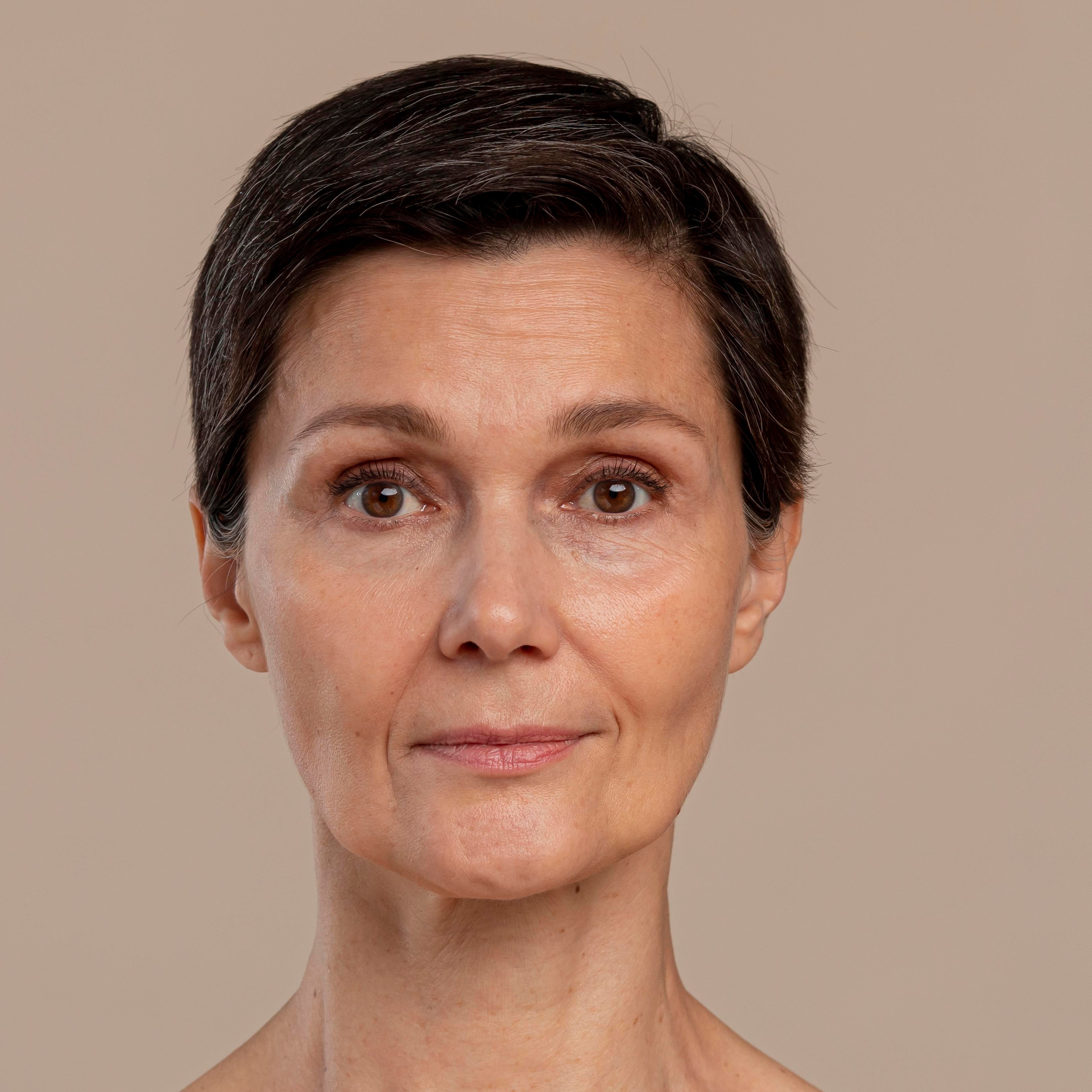 Side-by-side comparison of a woman's face with and without makeup on a beige background